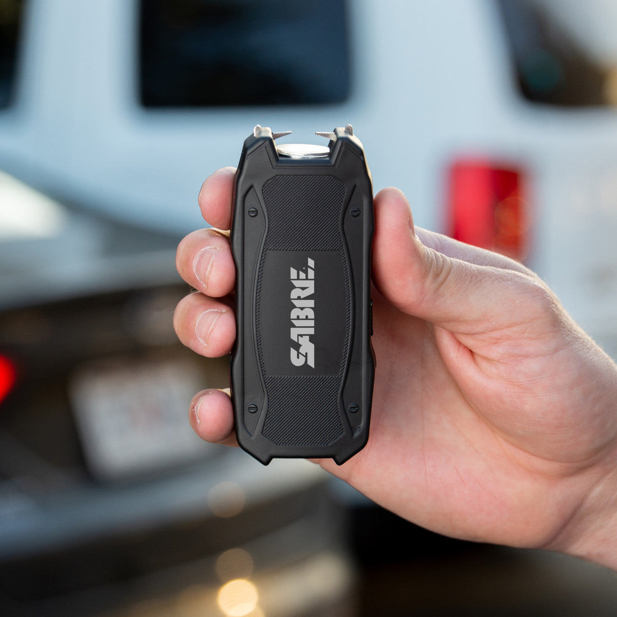 Sabre Stun Gun with Flashlight and Battery Strength Indicator, 1.552 Microcoulombs (µC) Charge, 120 Lumen Flashlight, Increased Reliability, Safety Switch, Rechargeable, Compact Design, Black